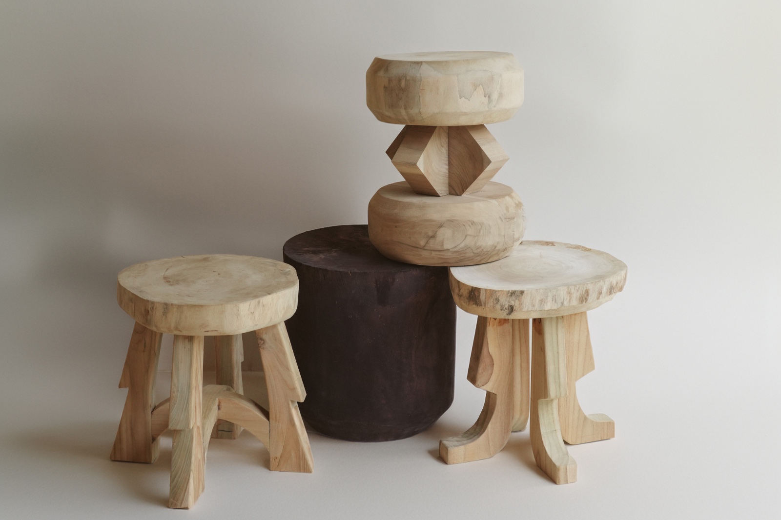 Handcrafted wooden stools and stone stool
